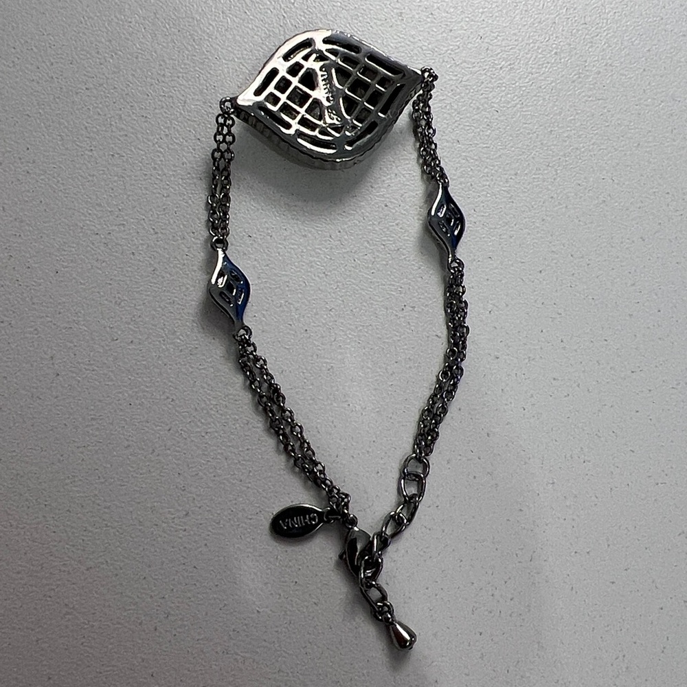 JTV JOAN BOYCE, GUNMETAL TONE
WITH WHITE CRYSTAL EVIL EYE
STATION BRACELET - Picture 7 of 7